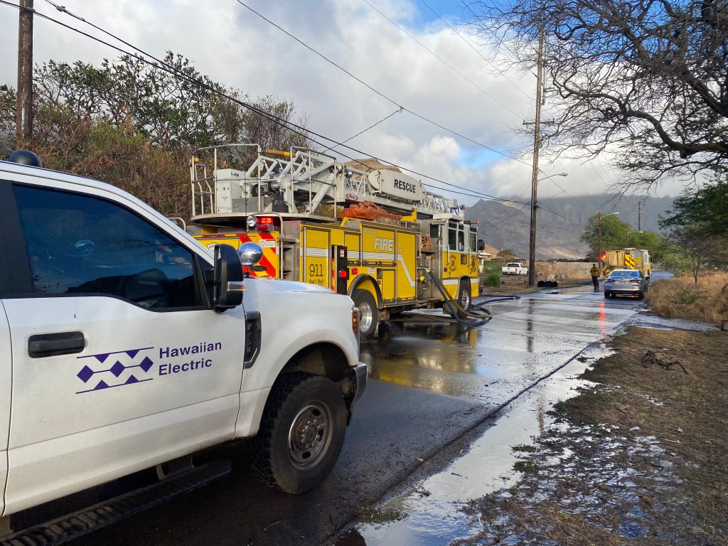 Fire crews respond to a 10-acre wildfire in Waianae Valley on Tuesday, after a Hawaiian Electric spotter said he saw a pole fall in that area amid the gusty winds.