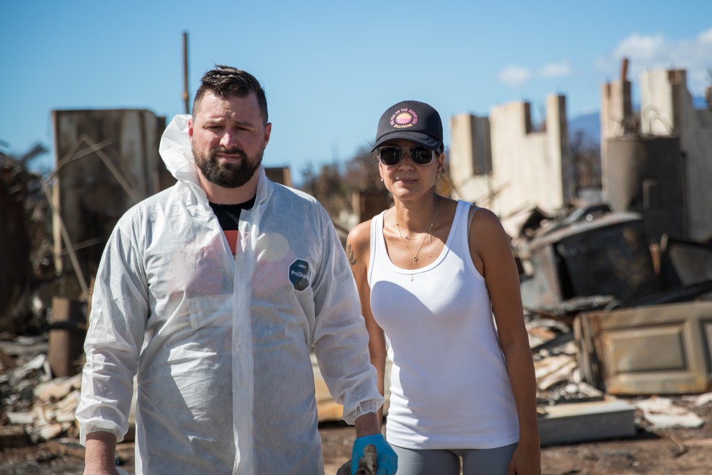 Mike Cicchino and his wife Andreza stand outside what's left of their home on Pupu Place in Lahaina. (Nathan Eagle/Civil Beat/2023)