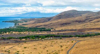 Olowalu is about five miles south of Lahaina. The two cone-shaped mounds in the center are in the proposed landfill site for the debris. (Nathan Eagle/Civil Beat/2023)
