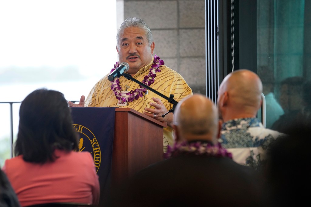 Department of Education Superintendent Keith Hayashi delivers the special message during the blessing of the Waipahu High School Integrated Academy Learning Center  Friday, Dec. 1, 2023, in Waipahu. The center offers students the opportunity to learn trades and skills. (Kevin Fujii/Civil Beat/2023)