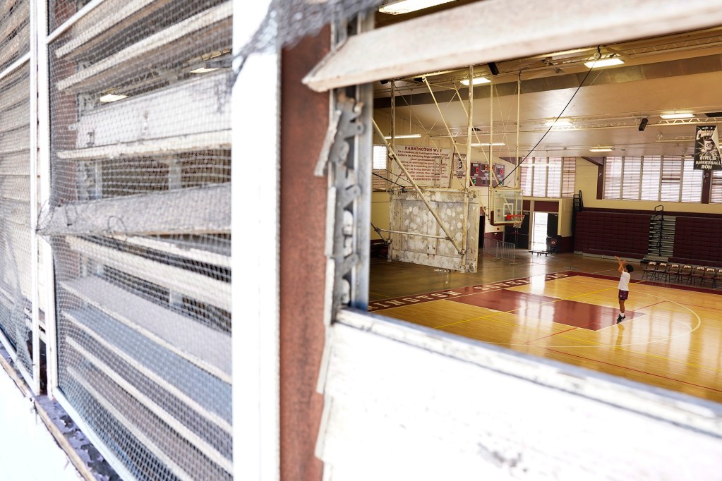 Broken windows of Farrington High School’s Kitamura Gym are photographed Friday, Dec. 29, 2023, in Honolulu. Lack of CIP funding for repairs and renovations have created a safety hazard for students, faculty, staff and visitors. (Kevin Fujii/Civil Beat/2023)