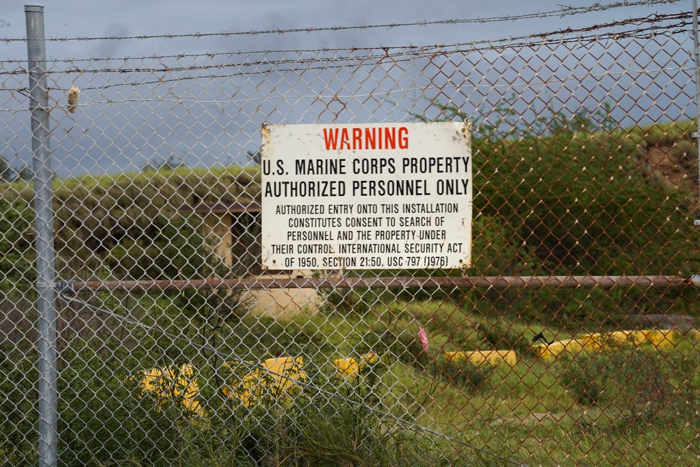 Puuloa Range Training Facility signs warn the public at Puuloa Beach Park Monday, Jan. 8, 2024, in Ewa Beach. The public beach park and civilian homes border the military’s firing range. (Kevin Fujii/Civil Beat/2024)