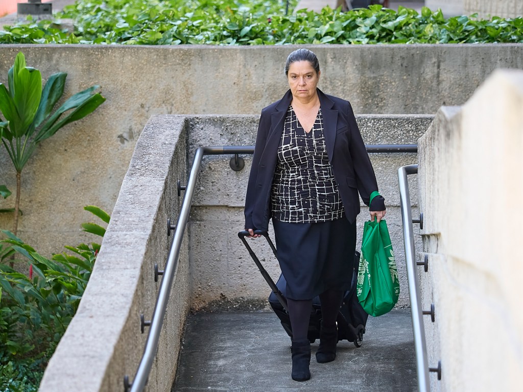 Defense attorney Lynn Panagakos leaves Federal Court.
