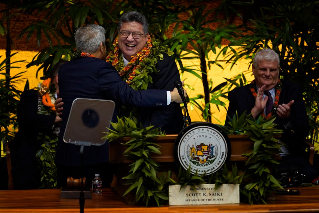 House of Representative Speaker Scott Saiki gives Senate President Ron Kouchi a lei after Gov. Josh Green’s state of the state address Monday, Jan. 22, 2024, in Honolulu. Kouchi joked about not receiving a lei when introduced. (Kevin Fujii/Civil Beat/2024)