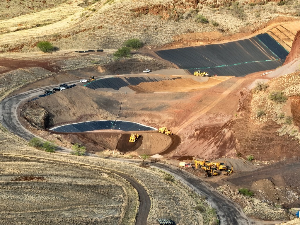 Construction crews were preparing the temporary dump site in Olowalu for the estimated 400,000 tons of debris and toxic ash from the Aug. 8 wildfire in Lahaina, Thursday. (Nathan Eagle/Civil Beat/2024)