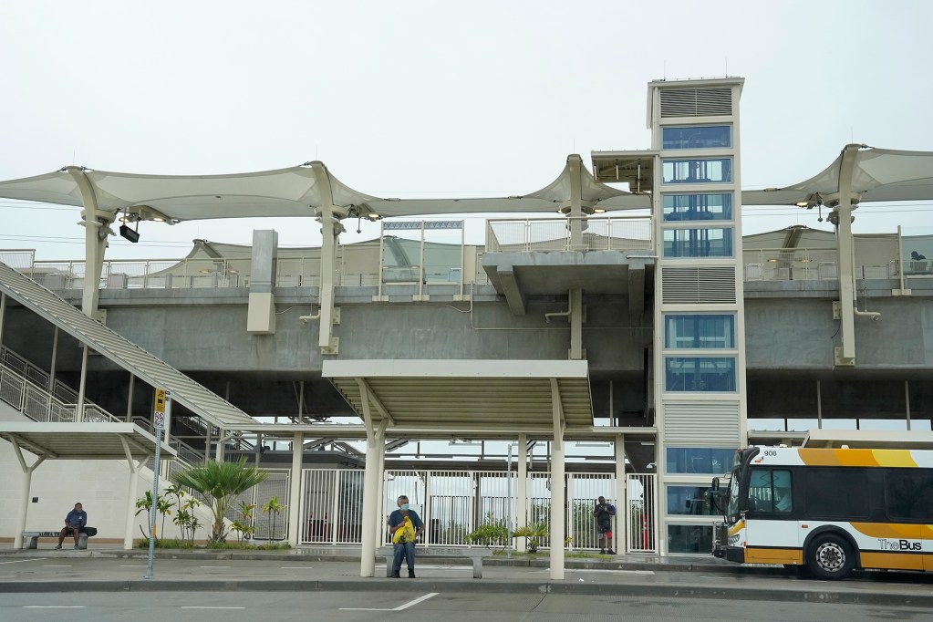 Three people wait at various stops for The Bus at the Halawa Aloha Stadium Station Thursday, Feb. 1, 2024, in Aiea. Stock photo of public transportation. (Kevin Fujii/Civil Beat/2024)