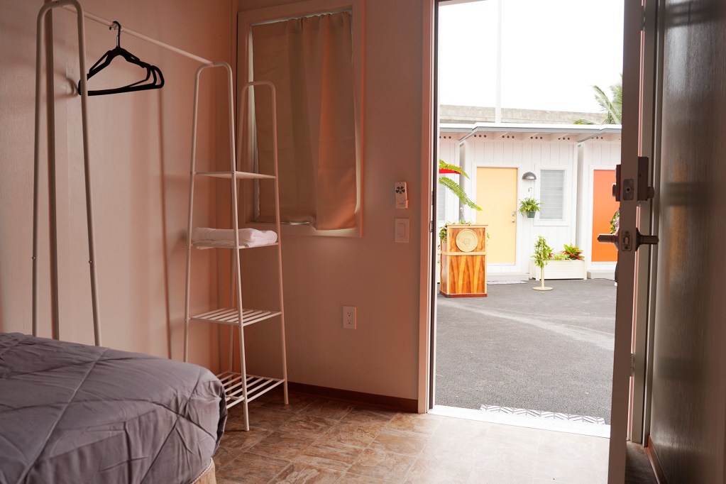 The blessing for Ho’okahi Leo Kauhale takes place Thursday, Feb. 15, 2024, in Honolulu. The kauhales offer affordable rent for tenants to break the cycle of homelessness. (Kevin Fujii/Civil Beat/2024)