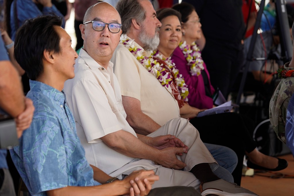 Maui Oceanview LP President Paul Cheng finds a distraction during the King Kamehameha III Elementary School’s temporary Pulelehua campus blessing ceremony Monday, March 25, 2024, in Lahaina. Kam3’s building was destroyed the Aug. 8 fire. (Kevin Fujii/Civil Beat/2024)