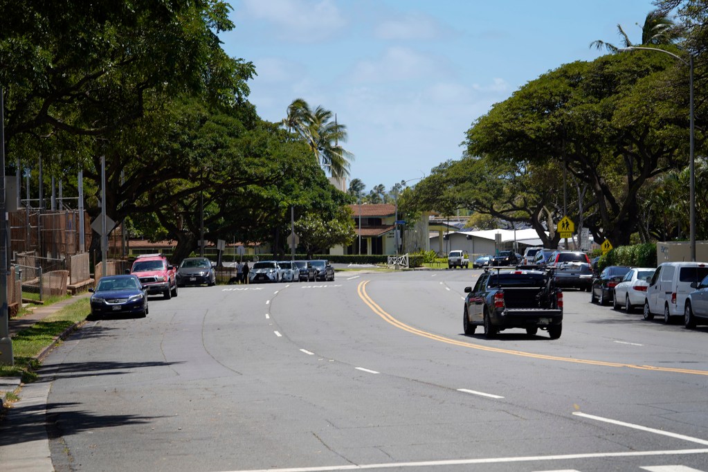 A pick-up truck drives on Kilauea avenue at Hunakai Street in Honolulu Friday, March 29, 2024. (Kevin Fujii/Civil Beat/2024)