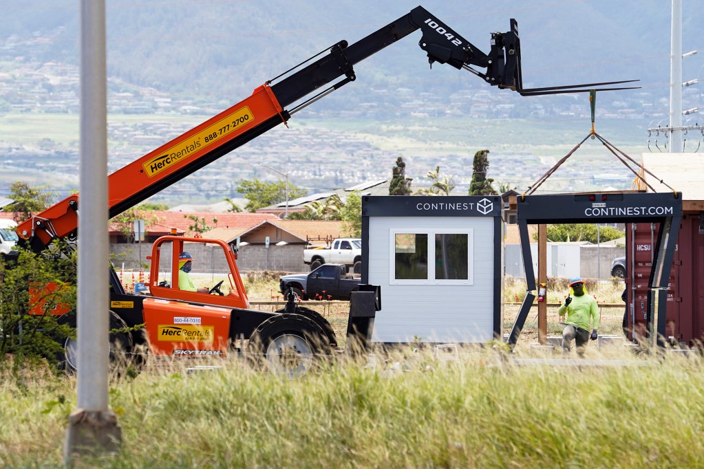 A Continest temporary container shelter is raised at Ohana Hope Village Monday, April 8, 2024, in Kahului. (Kevin Fujii/Civil Beat/2024)