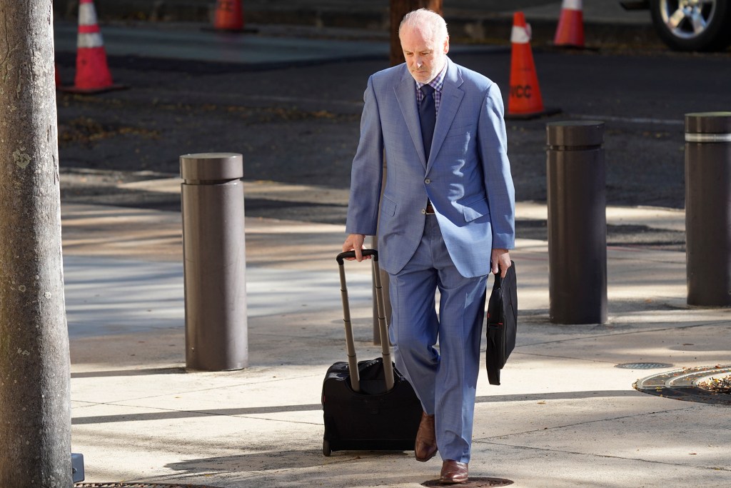 Michael Miske defense attorney Michael Kennedy walks to the federal courthouse Wednesday, April 17, 2024, in Honolulu. (Kevin Fujii/Civil Beat/2024)