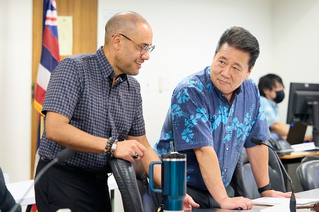 Donovan Dela Cruz Senate Ways and Means Chair spars with House Finance Chair Kyle Yamashita, before a committee hear for the financing of Bills (David Croxford/Civil Beat/2024)