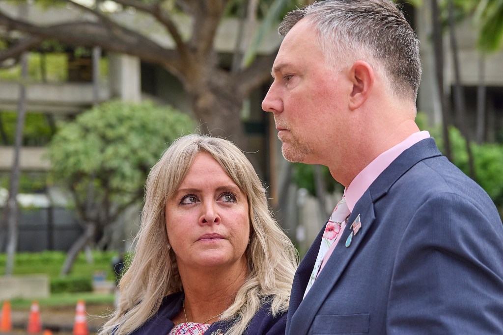 Army Maj. Amanda Feindt and her husband Patrick talk to reporters outside the Prince Jonah Kuhio Kalanianaole Federal building minutes before the court opened.  The Feindt’s were victims of the Red Hill fuel leak when the fuel tainted water was allowed to arrive at their home on Ford island.  (David Croxford/Civil Beat/2024