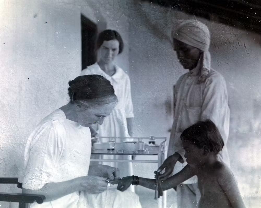Photo of Dr. Isabel Kerr, a European missionary, administering to a patient a chaulmoogra oil treatment in 1915, prior to the invention of the Ball Method.