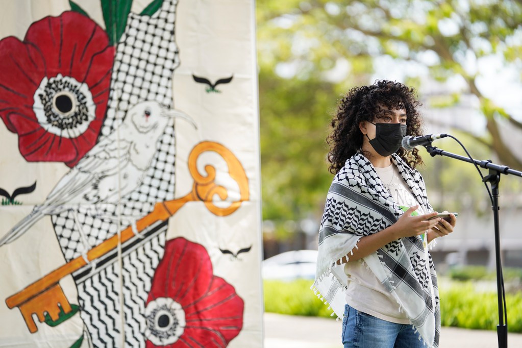 A student who did not want to be identified speaks at the Students and Faculty for Justice in Palestine rally at UH Manoa Friday, May 3, 2024, in Honolulu. The students presented a list of demands to the UH administration regarding the conflict in Gaza. (Kevin Fujii/2024)