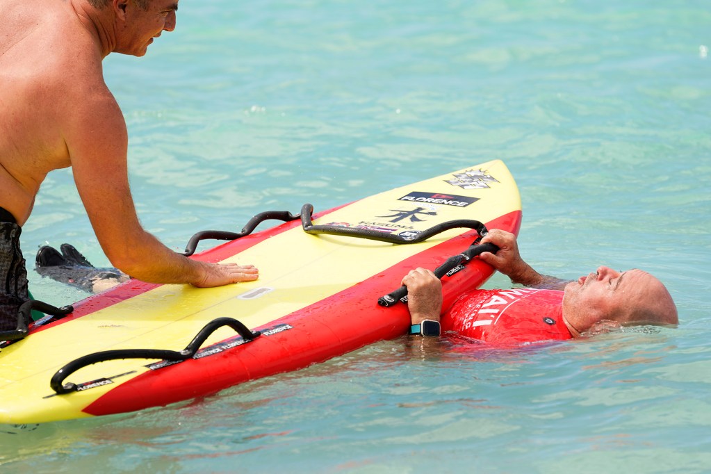 Eric Lazar of Kauai prepares to compete in the 2024 Hawaii Adaptive Surfing Championships Prone Assist division Monday, May 13, 2024, in Honolulu. (Kevin Fujii/Civil Beat/2024)