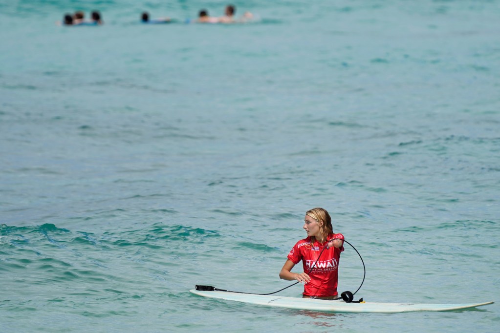 Faith Lennox of Maui returns to the beach after her 2024 Hawaii Adaptive Surfing Championships Upper Limb Standing mixed heat Tuesday, May 13, 2024, in Honolulu. (Kevin Fujii/Civil Beat/2024)