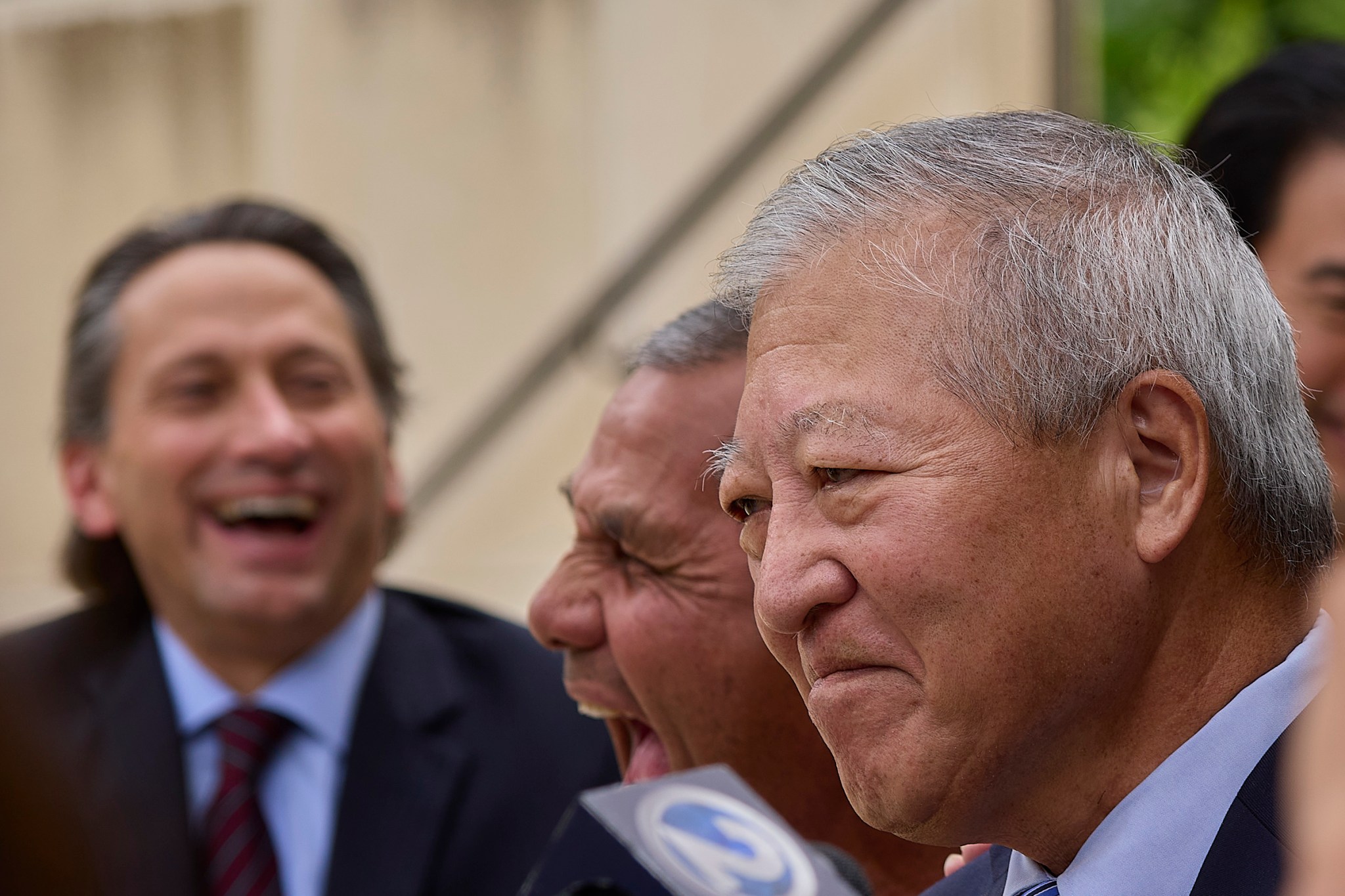 Following the Not Guilty verdict in the Kaneshiro/Mitsunaga et al bribery trial most of the defendants appeared outside the courthouse to speak with local press. (David Croxford/Civil Beat/2024)