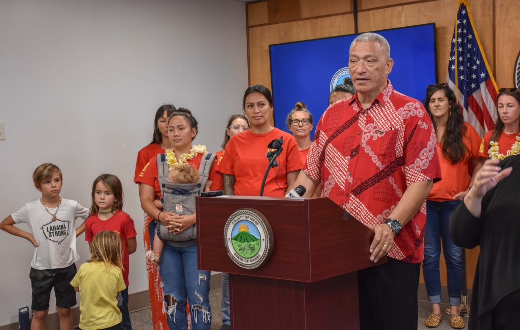Maui Mayor Richard Bissen, flanked by members of Lahaina Strong, announces a bill that would eliminate more than 7,000 short-term rentals on Maui by 2026. (Cammy Clark/Civil Beat/2024)