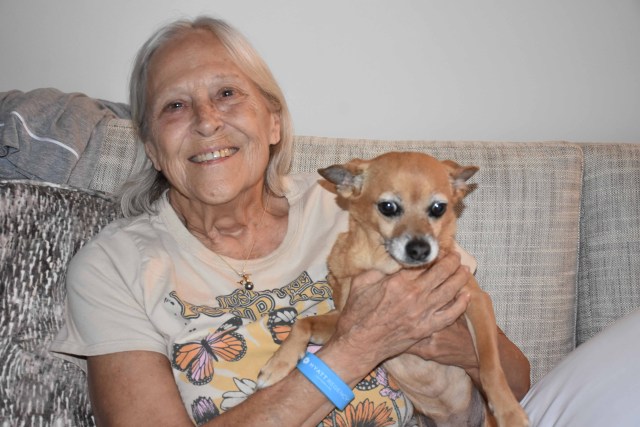 Fire survivor Joy Newman, 71, and her dog Malia were happy to move out of a resort hotel and into a condo in West Maui through FEMA's direct lease program. (Cammy Clark/Civil Beat/2024)