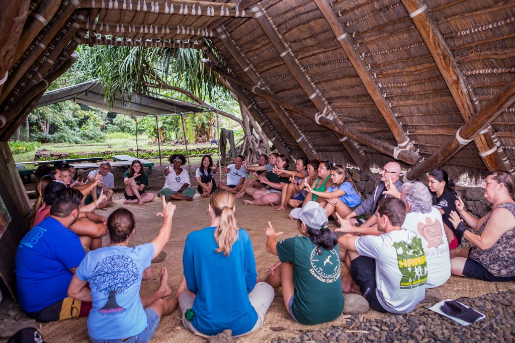 Teachers in the University of Hawaii’s Ethnomathematics Graduate Program participate in a lesson at the Ka Papa Loi O Kanewai cultural heritage center on Hawaiian anthropic measurements using their bodies as tools for geometry and measurement. (University of Hawaii Manoa)