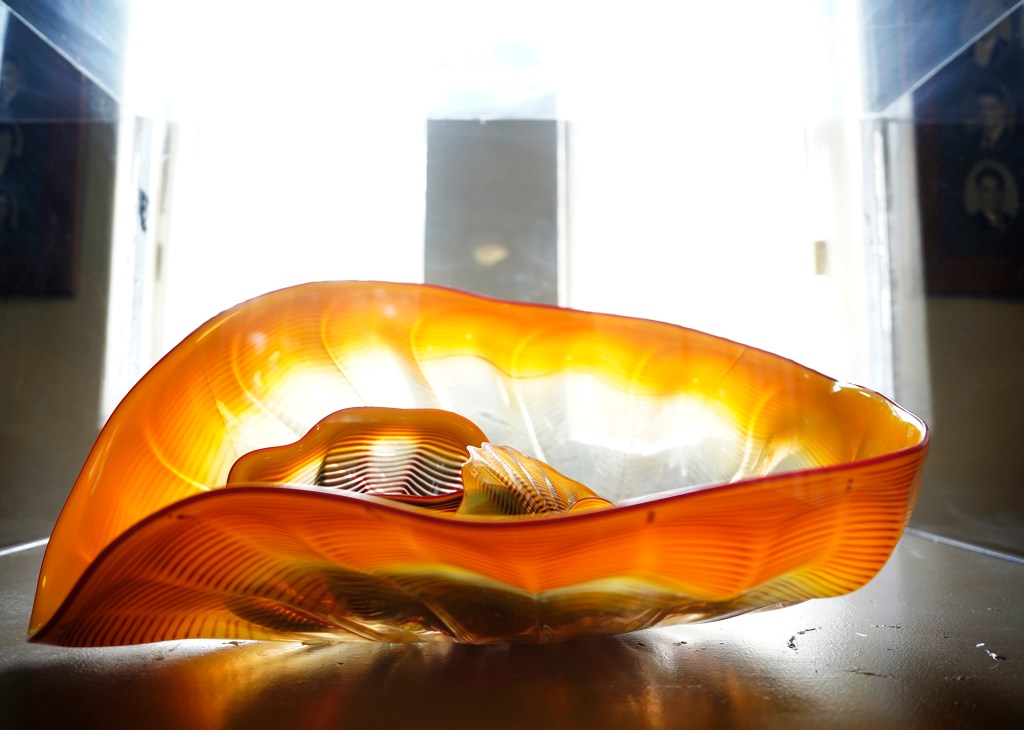 Golden Yellow Sea Foam by Dale Chihuly sits on the Diamond Head side of Honolulu Hale’s second floor hallway  Tuesday, June 4, 2024, in Honolulu. The City and County of Honolulu purchased this artwork in 1992. Chihuly of Tacoma, Washington, is well known for his glass artwork. (Kevin Fujii/Civil Beat/2024)