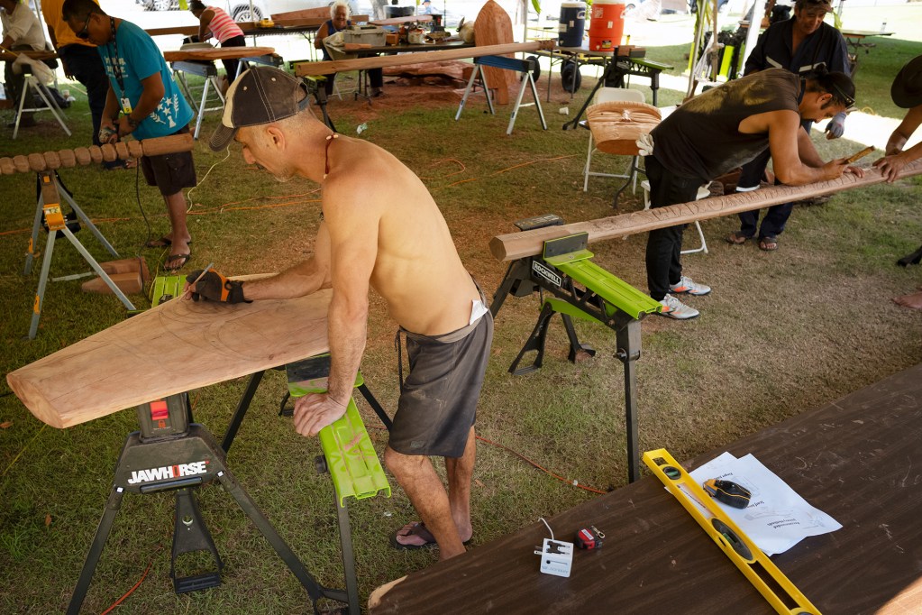 FestPac wood carvers create paddles at the Bishop Museum Sunday, June 8, 2024, in Honolulu. (Kevin Fujii/Civil Beat/2024)