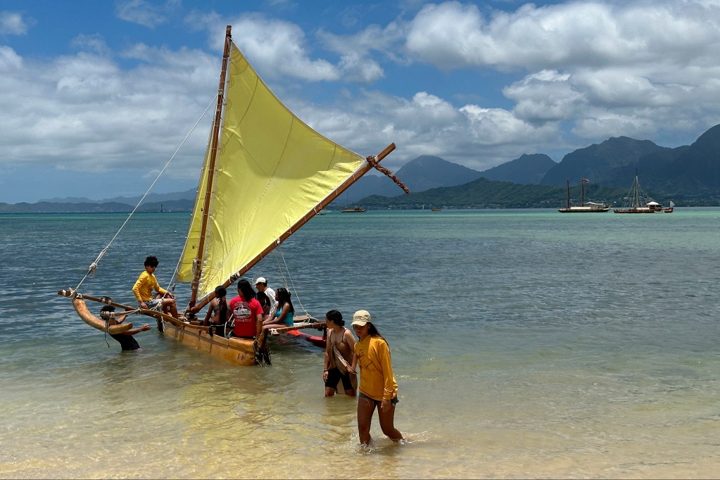 Keiki set sail into Kaneohe Bay Sunday, June 9, 2024, at Kualoa Regional Park in Kaneohe. The ride is offered as part of FestPac. (Kevin Fujii/Civil Beat/2024)