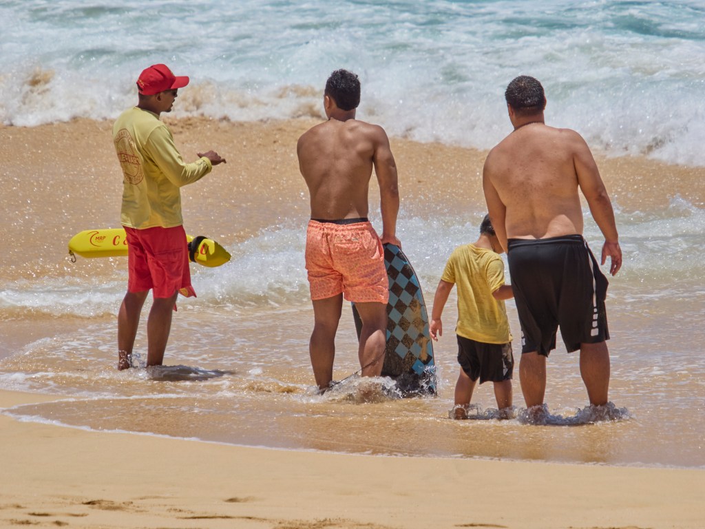 At Sandy’s Beach on the east side of Oahu on June 26th Lifeguards performed one of their normal duties keeping the public informed of the dangers associated with their stretch of the ocean, to ensure that new beachgoers and visitors alike enjoy a safe visit.Photographed June 26th, 2024(David Croxford/Civil Beat/2024)