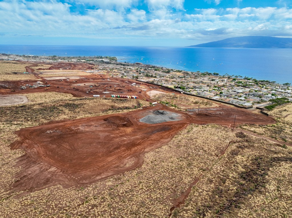 Two temporary group housing projects — one state and one federal — are under construction mauka of the Wahikuli neighborhood in Lahaina. (Nathan Eagle/Civil Beat/2024)
