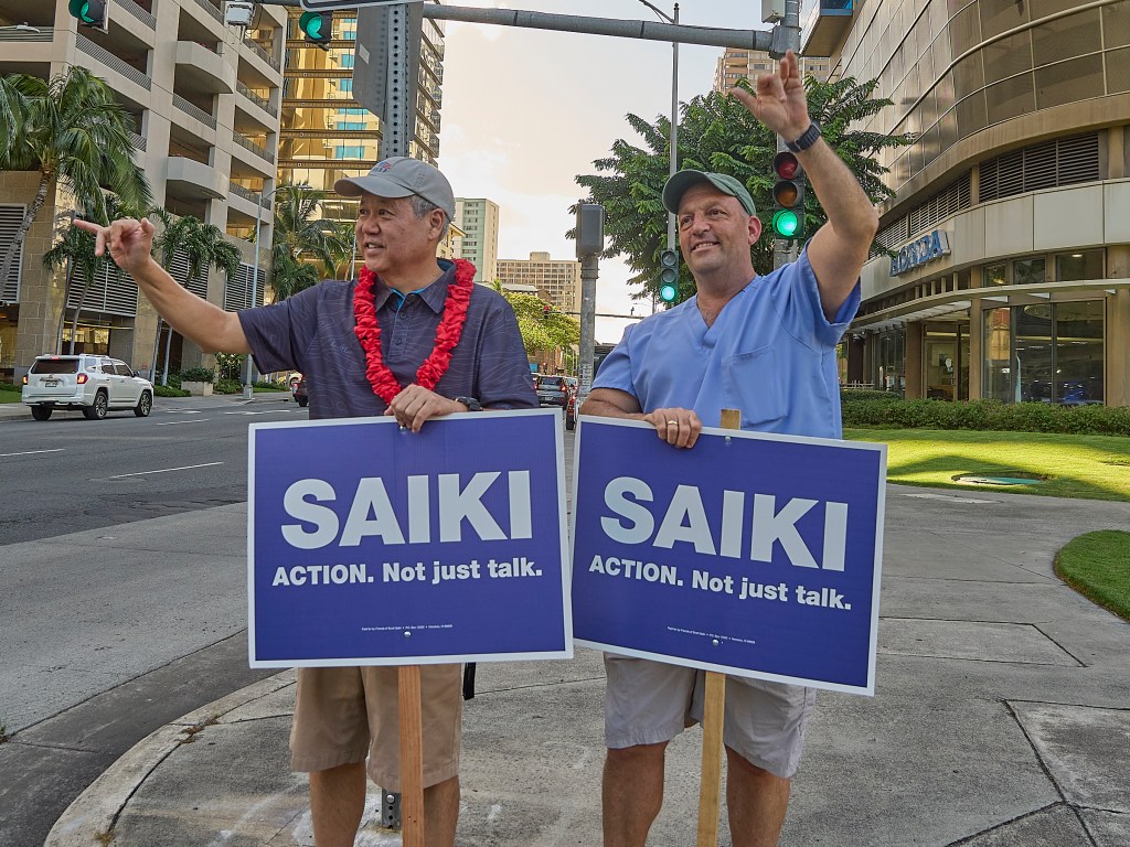 Hawaii Speaker of the House Scott Saiki was joined on Friday afternoon by Hawaii Gov. Josh Green at the corner of South Beretania and Alakea streets to sign wave during afternoon drive time. July 5th, 2024 (David Croxford/Civil Beat/2024)