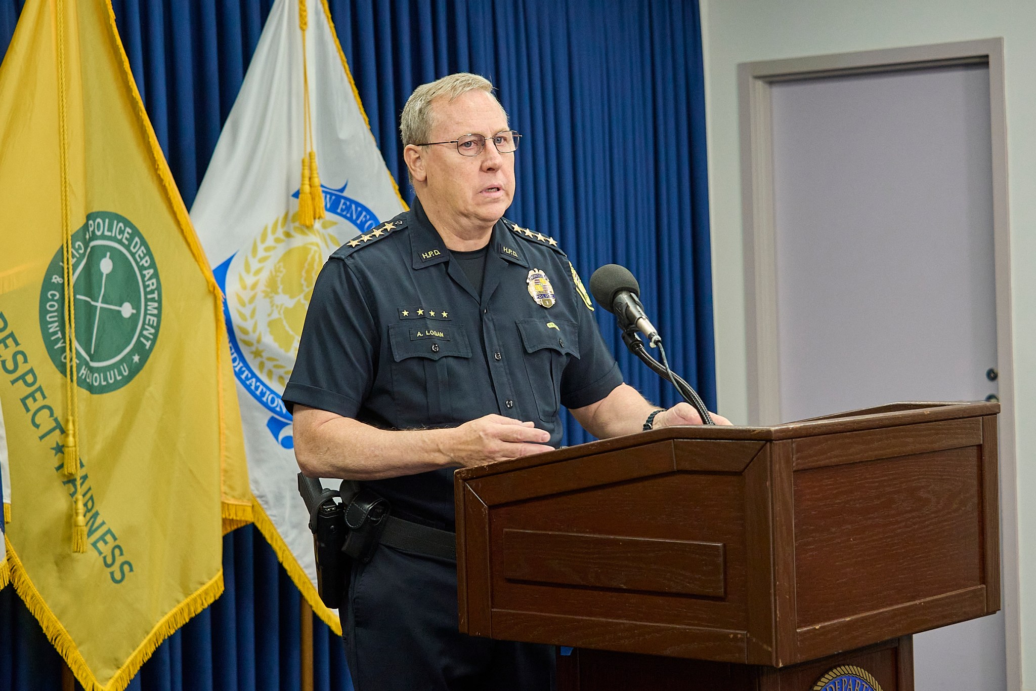 HPD Chief Joe Logan reports information of the fatal Police shooting at 2509 Ala Wai Blvd. The barricaded victim came out of the apartment brandishing a gun and pointed toward officers after non lethal canisters containing CS gas were deployed. The officers returned fire and fatally wounded the suspect who was believed to be the culprit in three earlier robberies.(David Croxford/CivilBeat/2024)