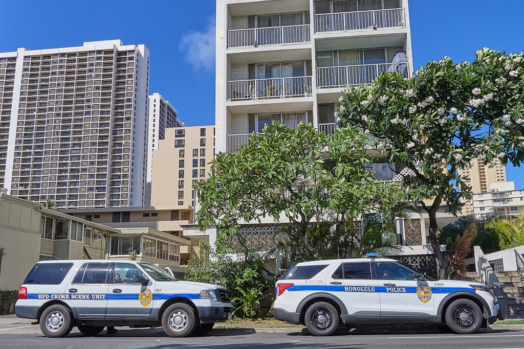 The scene of a fatal Police shooting at 2509 Ala Wai Blvd. photographed at 9:40 am.  The barricaded victim came out of the apartment brandishing a gun and pointed toward officers after non lethal canisters containing CS gas were deployed. The officers returned fire and fatally wounded the suspect who was believed to be the culprit in three earlier robberies.(David Croxford/CivilBeat/2024)