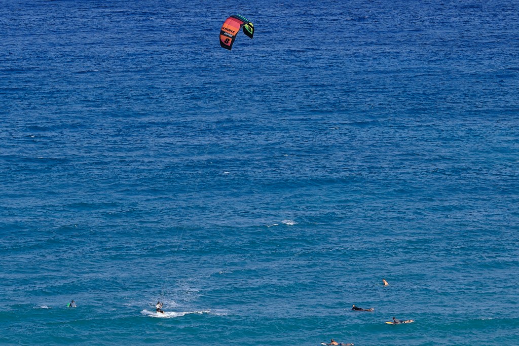 At Diamond Head Surf Break on OahuÕs south shore, surfers of different ilks took advantage of the small waves to improve their skills. Foil Surfing and Kite surfing both require a deeper investment in equipment to allow for skilled improvements. Photo graphed July 21st, 2024 (David Croxford/Civil Beat/2024)