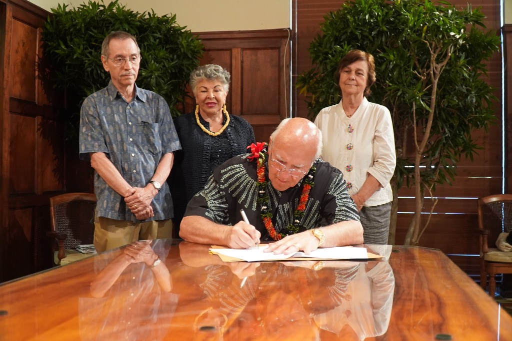Provided photo of a ceremony held at Honolulu Hale showing Mayor Rick Blangiardi signing Bill 23 (2024) into law, prohibiting gifts to City officers and employees valued at more than $50. Previously, gifts to City officers and employees worth up to $200 were allowed during a single fiscal year.