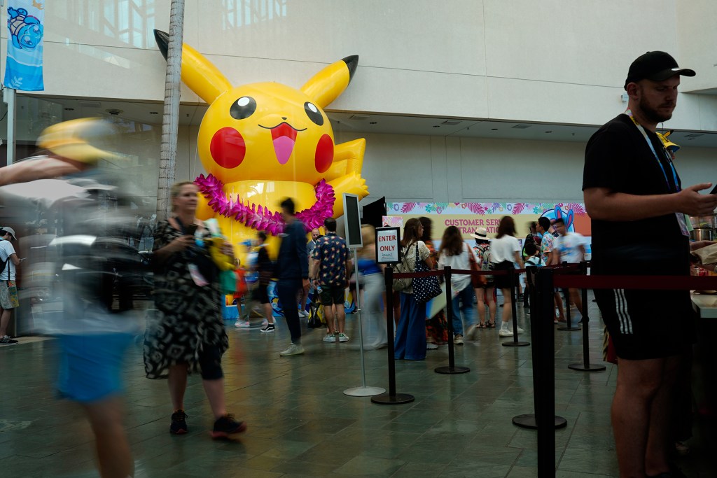 The most famous Pokemon pocket monster Pikachu sports a lei at the Pokemon World Championships Friday, Aug. 16, 2024, at the Hawaii Convention Center in Honolulu. The weekend-long event features the best Pokemon from all over the world. They’re competing for prize and the title of Pokemon World Champion. Competition and events are at the Convention Center. Other festivities can be found at the Hilton Hawaiian Village. (Kevin Fujii/Civil Beat/2024)