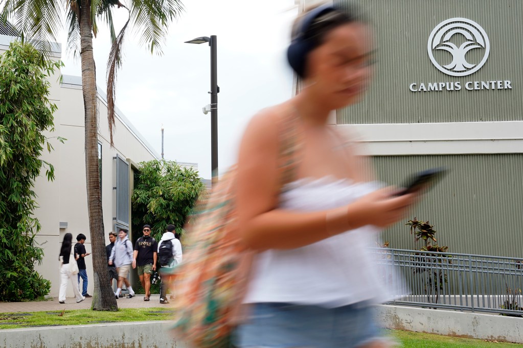 Students return to the University of Hawaii Manoa for the first day of classes Monday, Aug. 26, 2024, in Honolulu. The blur is a result of using a slow shutter speed of 1/20th of a second. (Kevin Fujii/Civil Beat/2024)