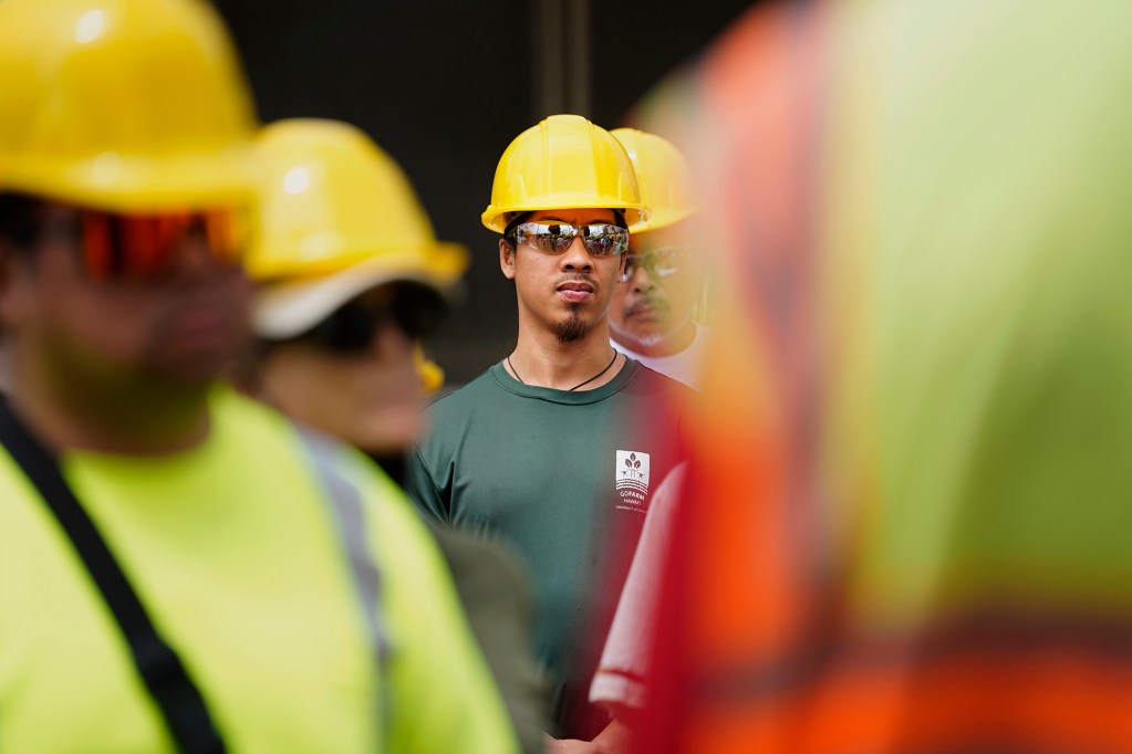 Tour de Trash participant Raymond Trinh listens to a briefing before entering H-Power’s facility Wednesday, Aug. 28, 2024, in Kapolei. H-Power incinerates rubbish to create energy. The City and County of Honolulu’s annual tour follows the journey of Oahu residents and visitors’ rubbish, recyclable items and compostable/green waste take through the collection and disposal process. (Kevin Fujii/Civil Beat/2024)