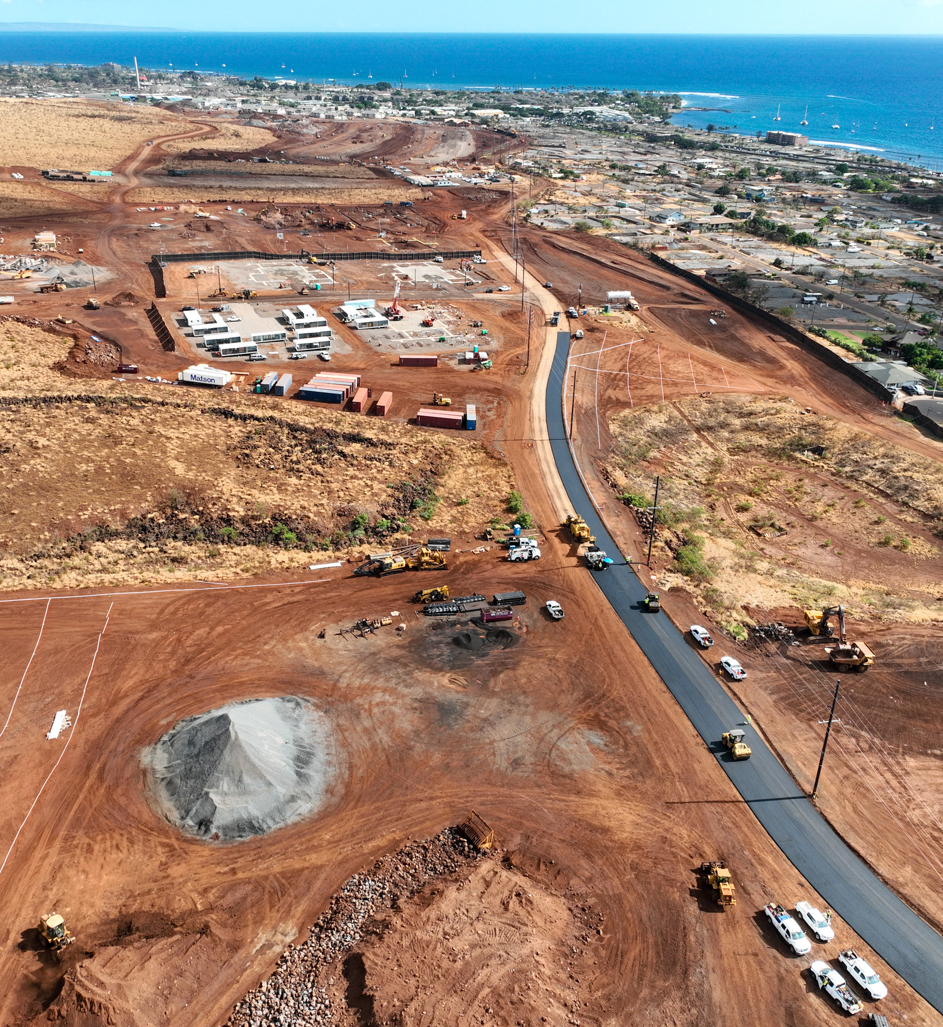 Two adjacent government-funded temporary group housing projects for Maui wildfire survivors were under construction mauka of the Wahikuli neighborhood in north Lahaina in July. (Nathan Eagle/Civil Beat/2024)