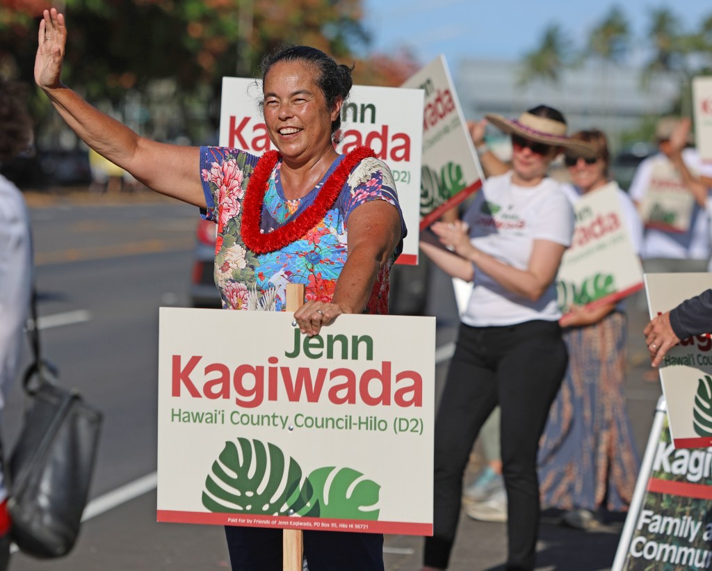 Big Island Councilwoman Jenn Kagiwada sign waves with her supporters along Hilo's Bayfront late Friday afternoon (Tim Wright/Civil Beat/2024)