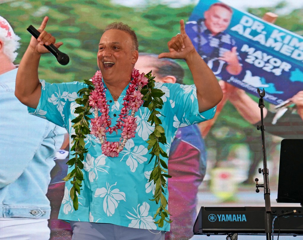 Dr. Kimo Alameda, a Mayor of Hawaii Island candidate, speaks to his supporters on Saturday night at Nani Mau Gardens (Tim Wright/Civil Beat/2024).