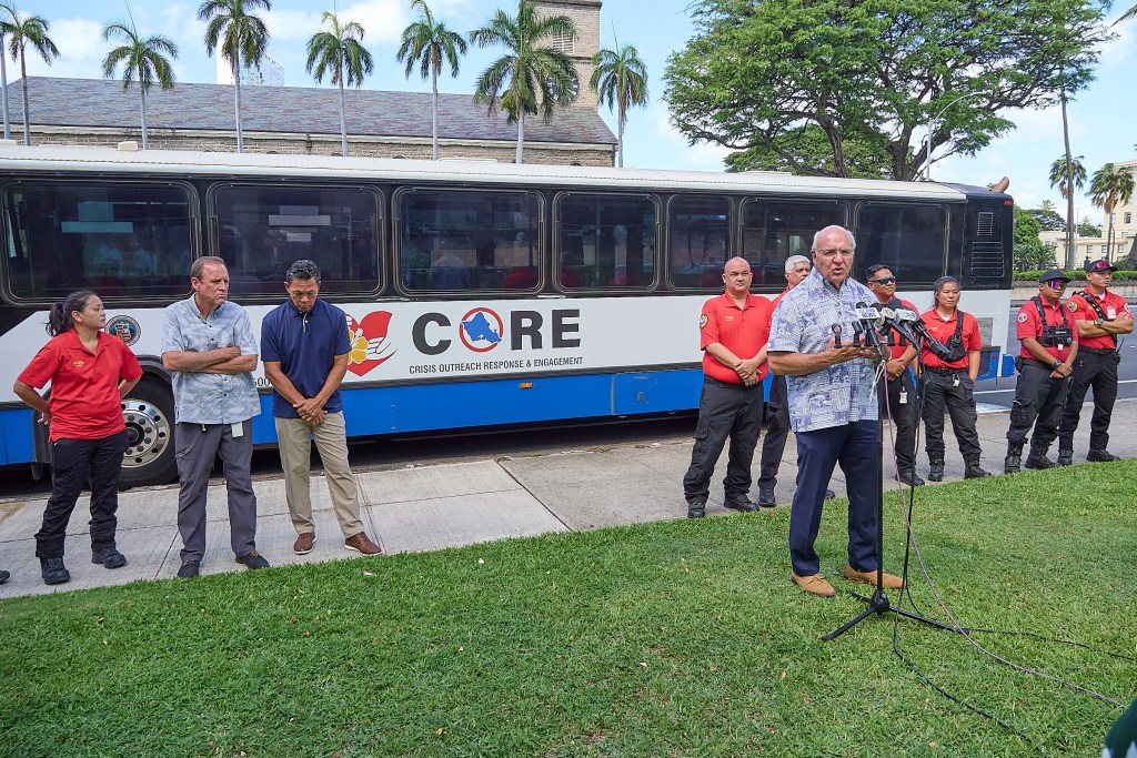 Mayor Rick Blangiardi, Anton Krucky along with several city officials and members of the City & County C.O.R.E. team gathered at Honolulu Hale to inaugurate a bus into the C.O.R.E. fleet of vehicles aimed at transporting homeless individuals to semi permanent and permanent care facilities around the island and also responding to major disasters as they ocurr. As one official said, “We aim to get people off the streets and into clean sheets”. The bus can move up to 12 people in beds and another 17 seated to facilities readied to receive candidates. (David Croxford/Civil Beat/2024)