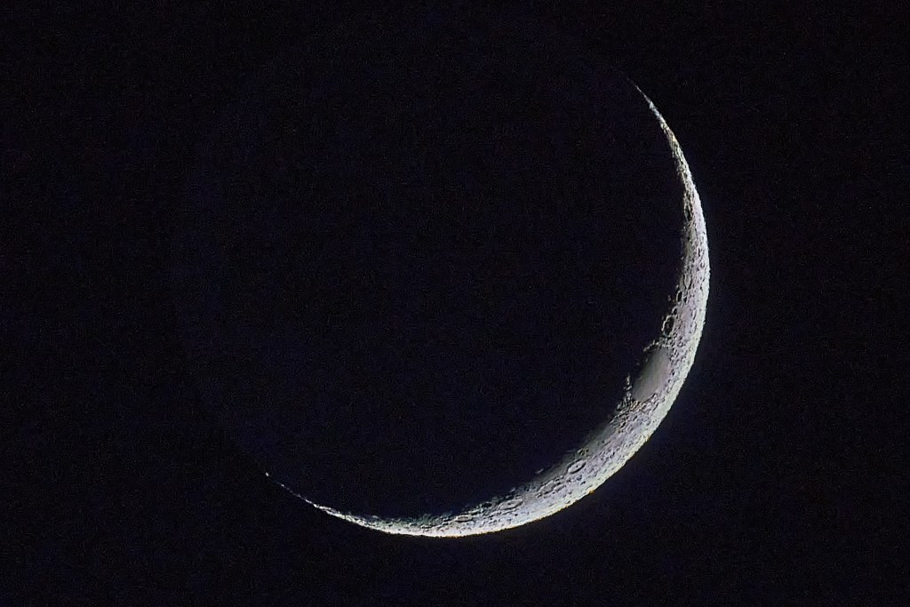 The 2 day old waxing crescent moon set on 9.5.24 at 8:22pm but before it dipped below the horizon for another evening, it showed off some of it’s fabulous craters along it’s edge.(David Croxford/Civil Beat/2024)