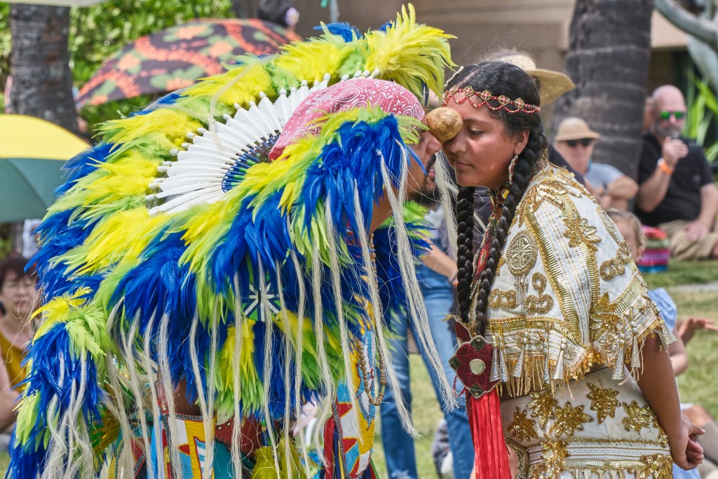 The 48th Annual Honolulu Intertribal Powwow presented by the Ho’opili Tribal council took place at Bishop Museum on September 21 and 22. David Whitebean dances the Potato Dance with his daughter Ruby Whitebean-Singh, from Vancouver, British Columbia, Canada. The dance is a competitive dance where the object of the competition is to keep the Potato between both partners foreheads while performing certain dance moves (touching the ground together, hopping twice, three times together, with dropping the potato. (David Croxford/Civil Beat/2024 (David Croxford/Civil Beat/2024