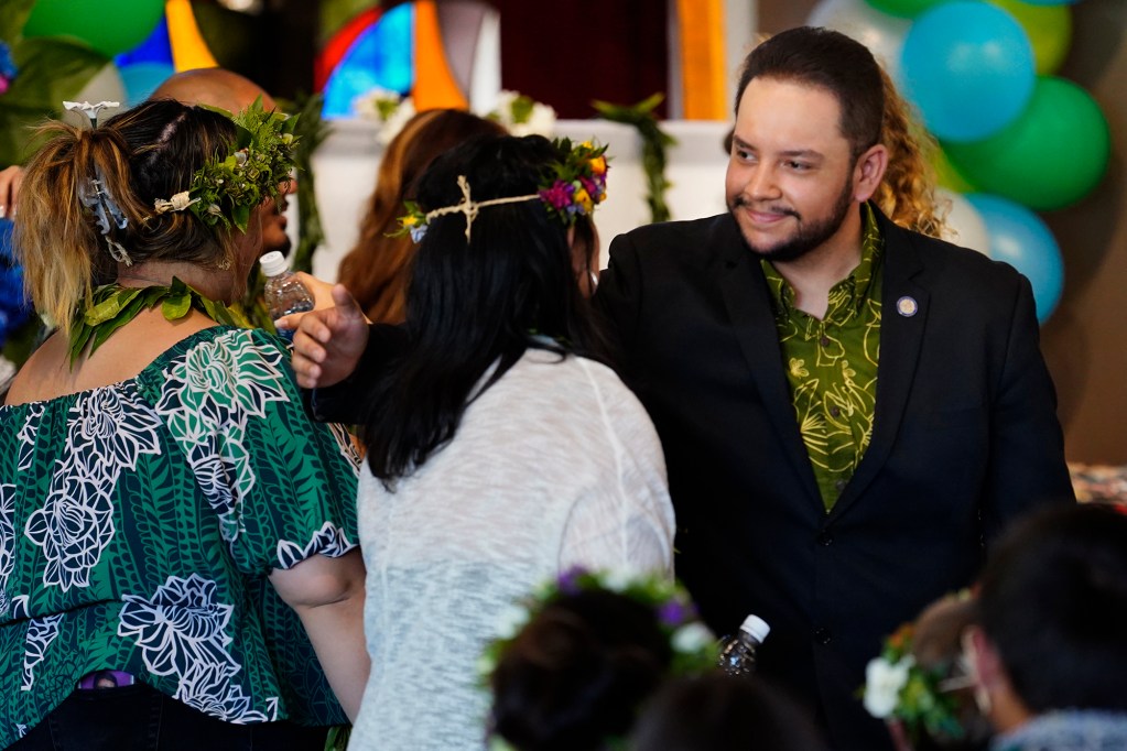 State Rep. Diamond Garcia hugs Courtney Raymond-Arakaki’s family during her memorial service Sunday, Sept. 22, 2024, in Honolulu. Raymond-Arakaki, 34, was killed in an ongoing dispute between neighbors in Waianae. (Kevin Fujii/Civil Beat/2024)