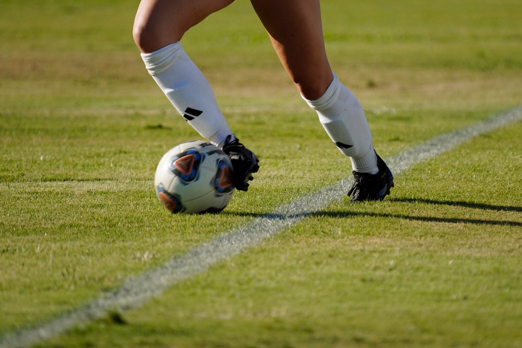 A University of Hawaii Wahine soccer players manages to keep the ball in play at the Diamond Head touchline during a game against Hawaii Pacific University Sunday, Sept. 22, 2024, at the Waipio Peninsula Soccer Stadium field in Waipahu. (Kevin Fujii/Civil Beat/2024)