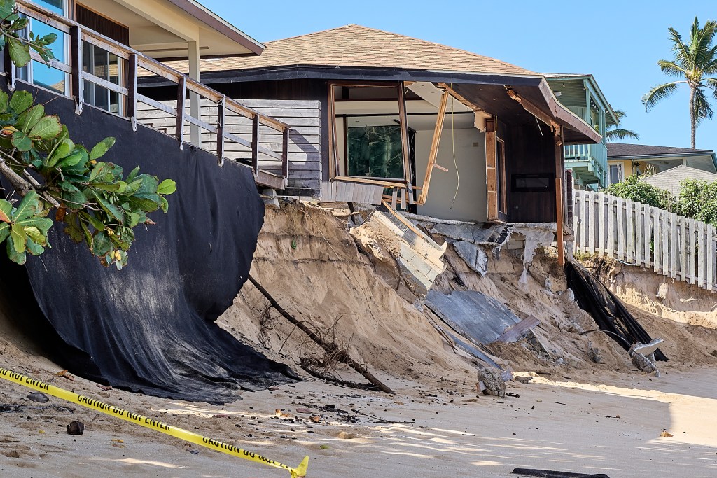 It’s just the beginning of the 2024-2025 big surf season that is expected to bring waves with surf heights as large as 40 ft faces. These homes in the vicinity of 59-147 and 59-149 Ke Nui Road just south of Sunset Beach on Oahu’s famed North Shore are already beginning to show signs of collapse and will probably not survive. (David Croxford/Civil Beat/2024)