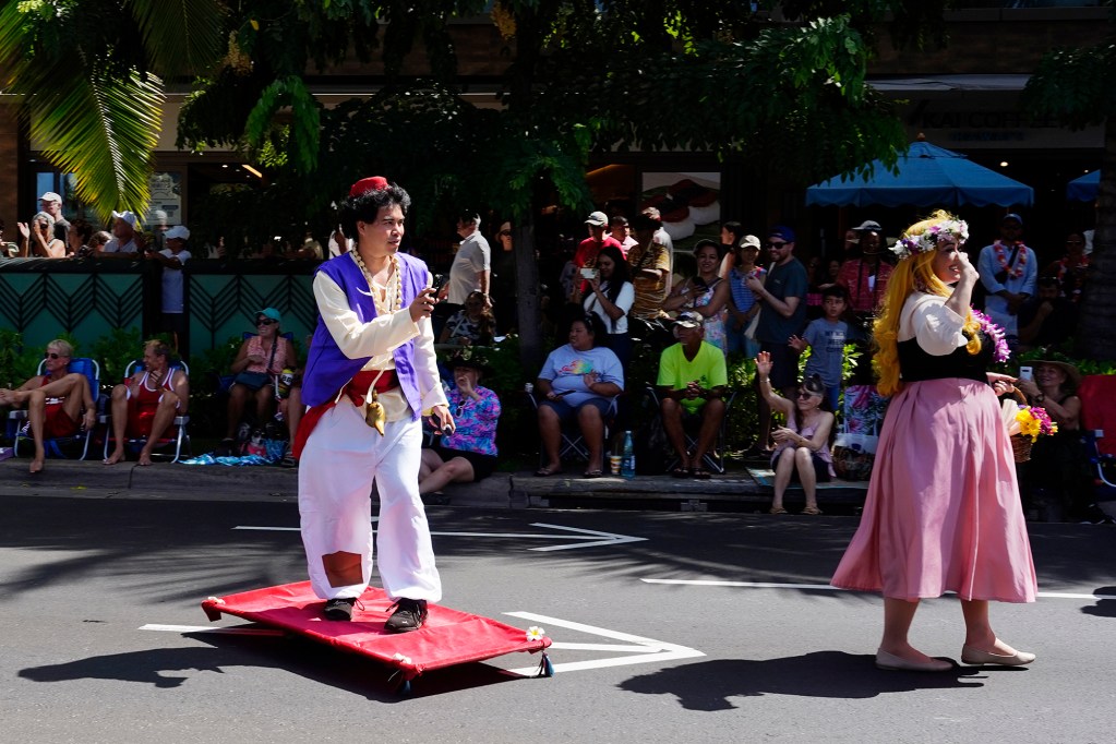 Aladdin with the Cosplayers of Hawaii flies on his magic carpet during the Aloha Festivals 76th Annual Floral Parade Saturday, Sept. 25, 2024, in Honolulu. (Kevin Fujii/Civil Beat/2024)