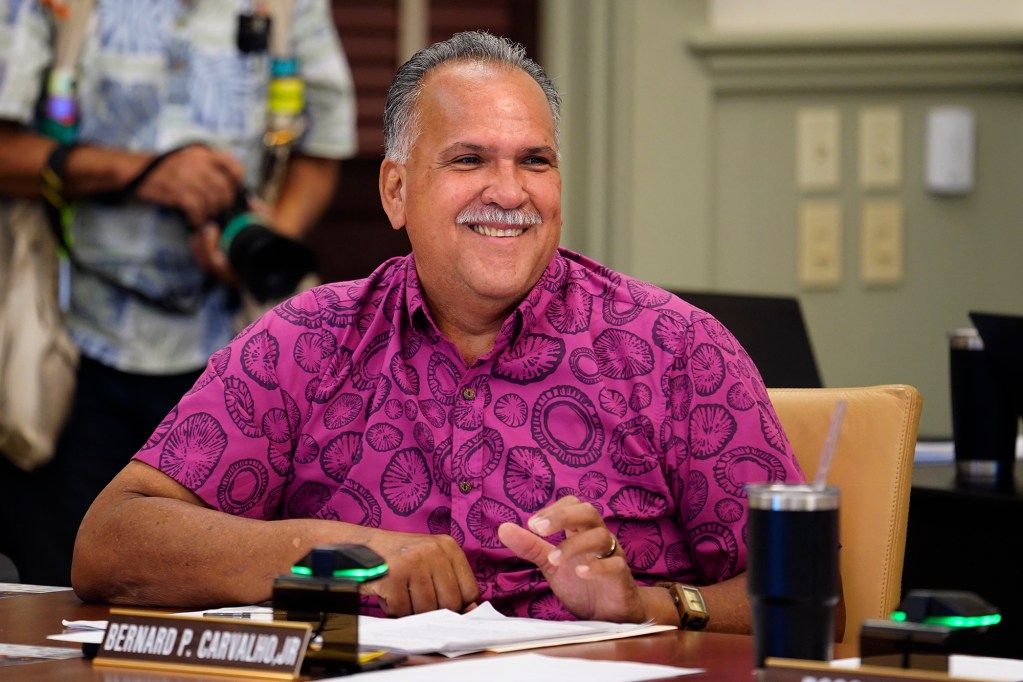 Kauai County Council member Bernard Carvalho, Jr., enjoys a light moment during their meeting Wednesday, Oct. 9, 2024, in Lihue. (Kevin Fujii/Civil Beat/2024)