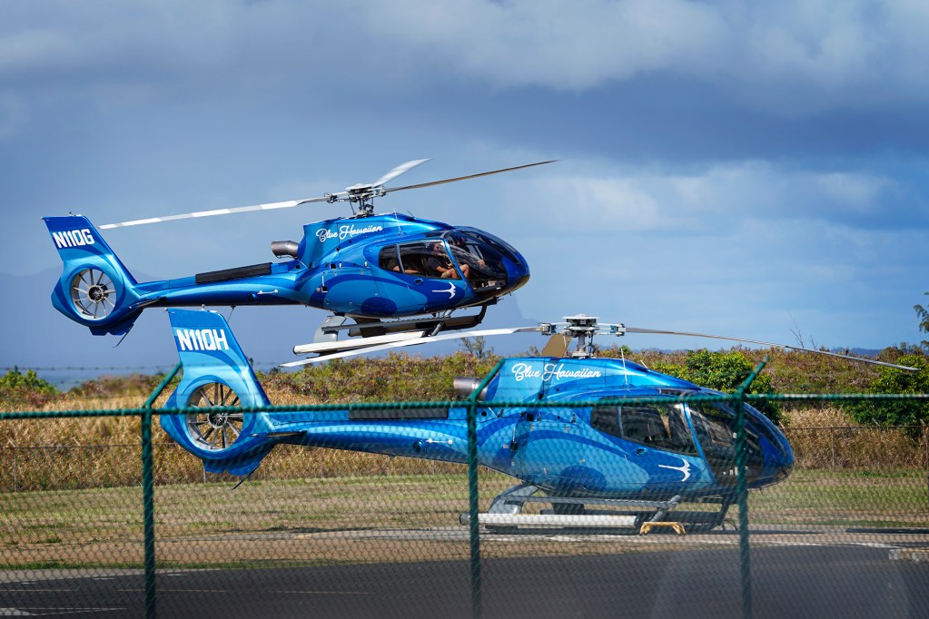 A Blue-Hawaiian tour helicopter prepares to land Wednesday, Oct. 9, 2024, in Lihue. (Kevin Fujii/Civil Beat/2024)